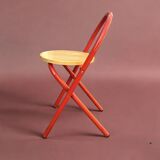 Vintage folding chair in red painted metal and wood