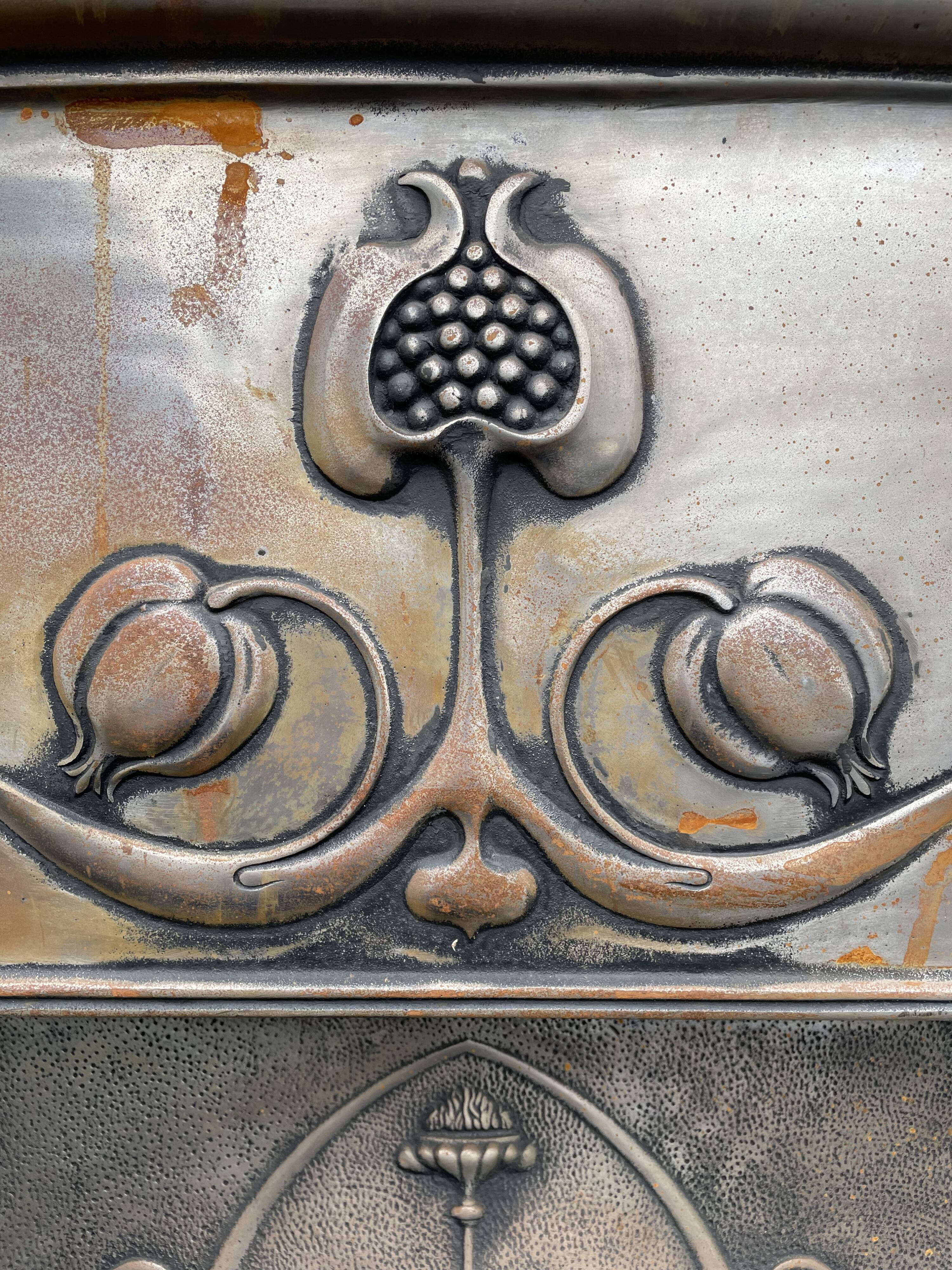 Open cast iron fireplace, Art Nouveau style