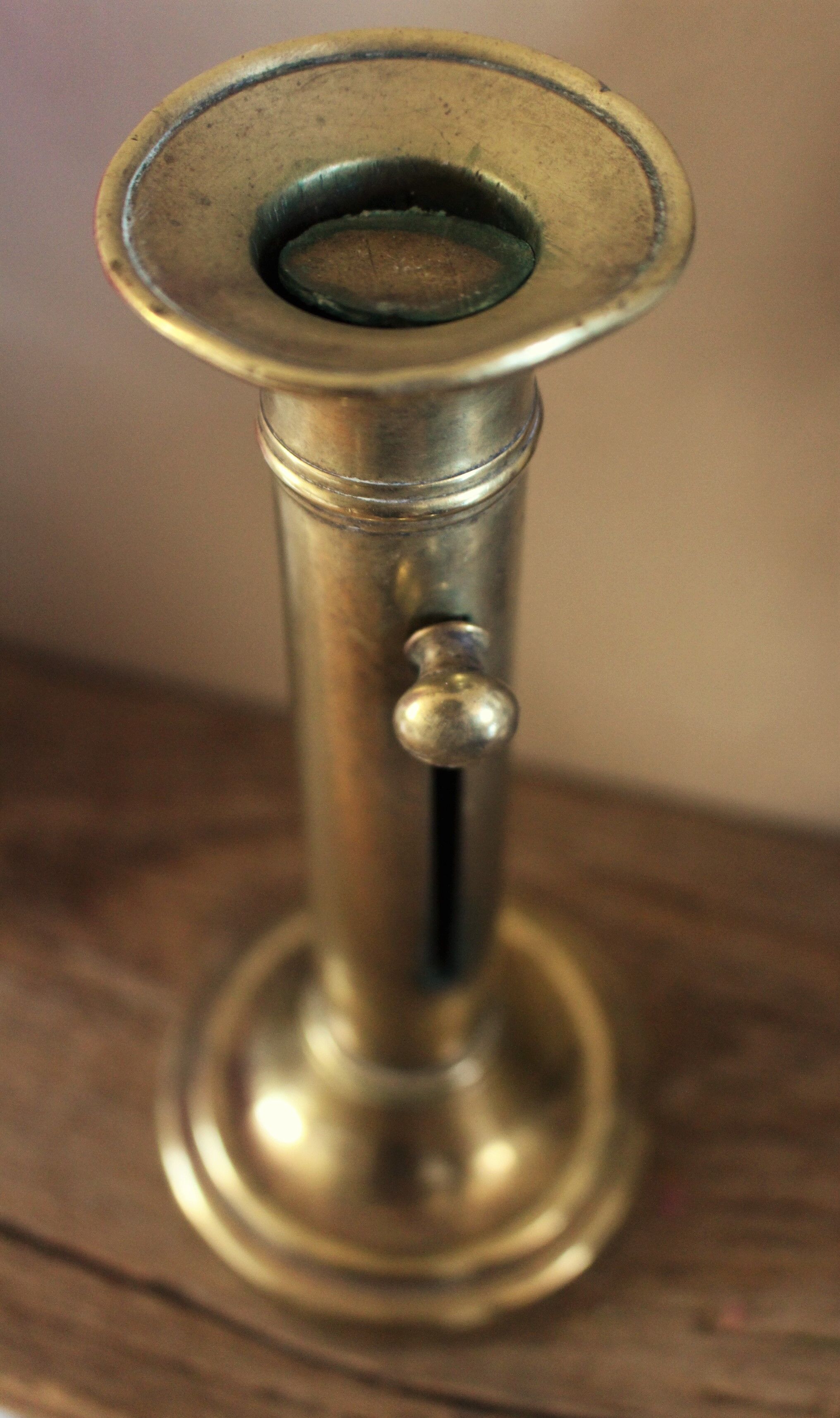 Push-button brass torch candle holder