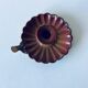 Old candle holder in brown enameled metal