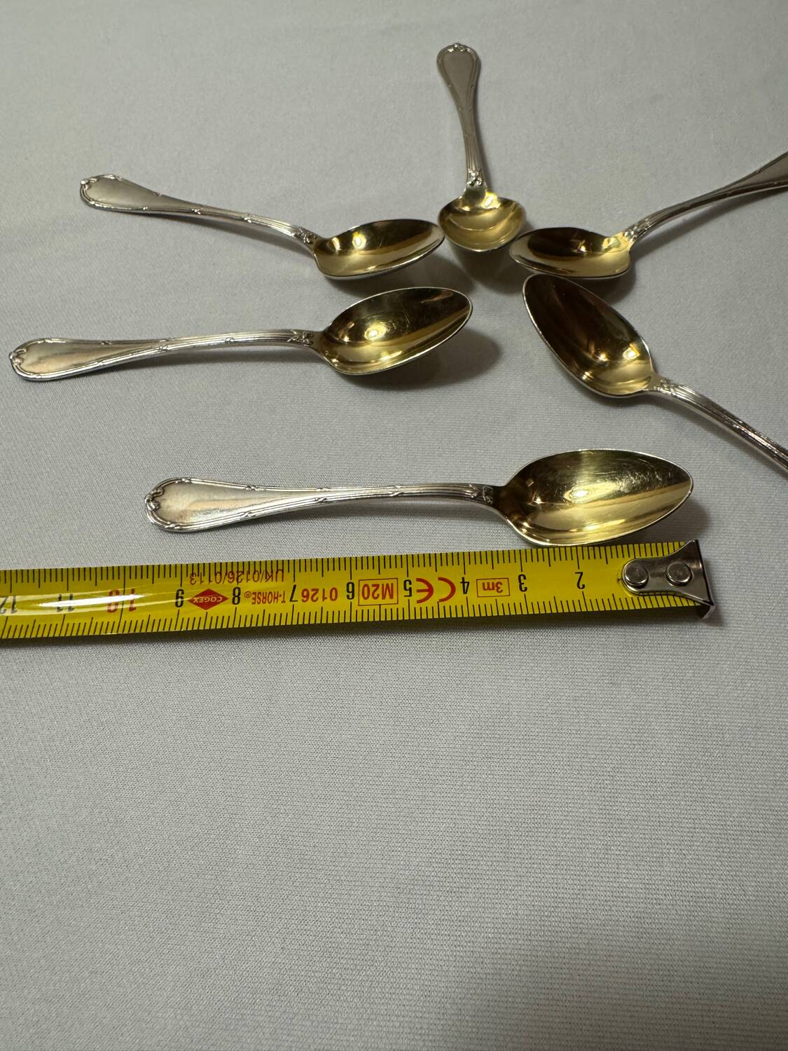 Six Christofle teaspoons, silver-plated vermeil