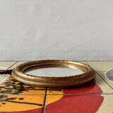 Small vintage wall mirror in gold painted wood