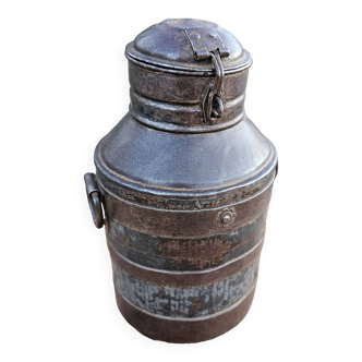 Old metal milk jug with beautiful original patina