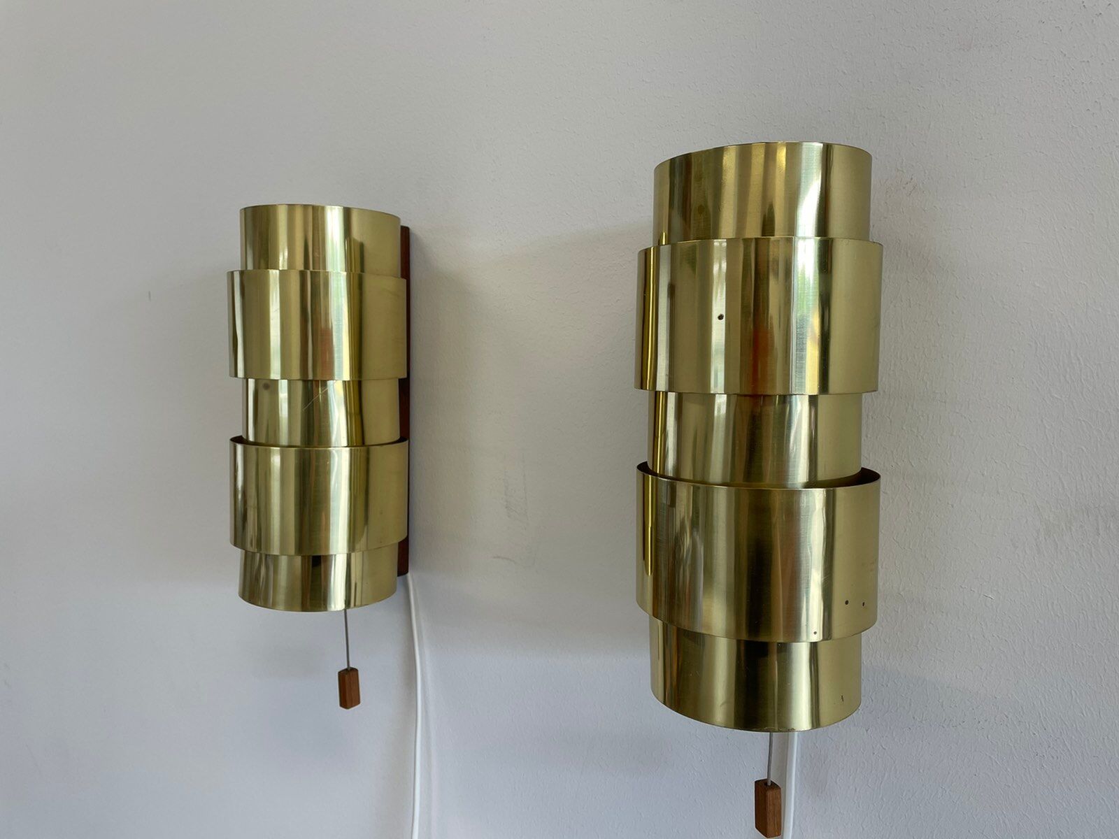 Pair of Scandinavian teak and brass sconces