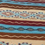 Multicolored hand-woven Berber rugs in natural wool