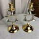 Pair of silver and gold metal candlesticks