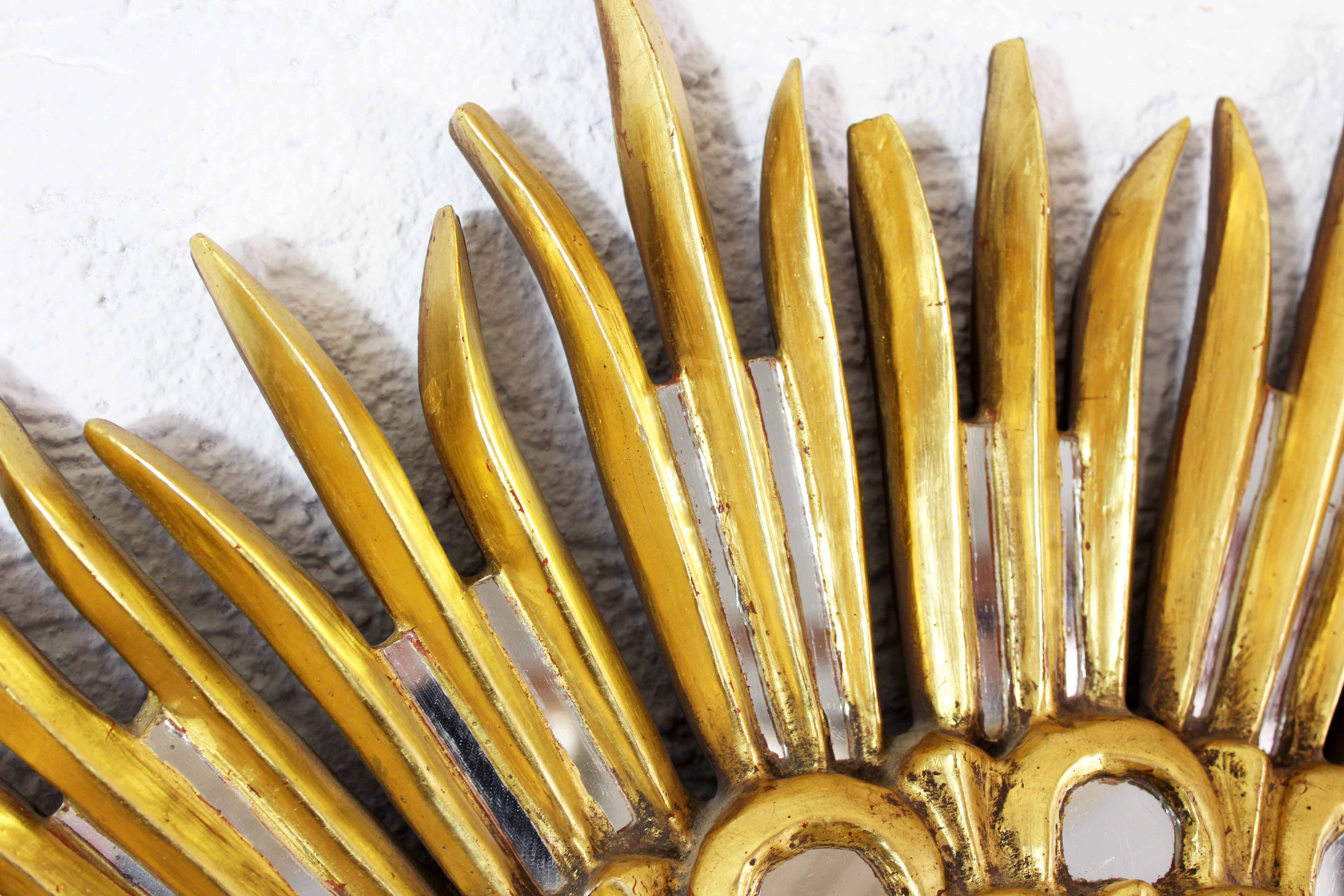 Sun mirror in wood and gilded stucco