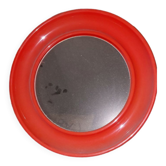 Orange round plastic mirror year 70