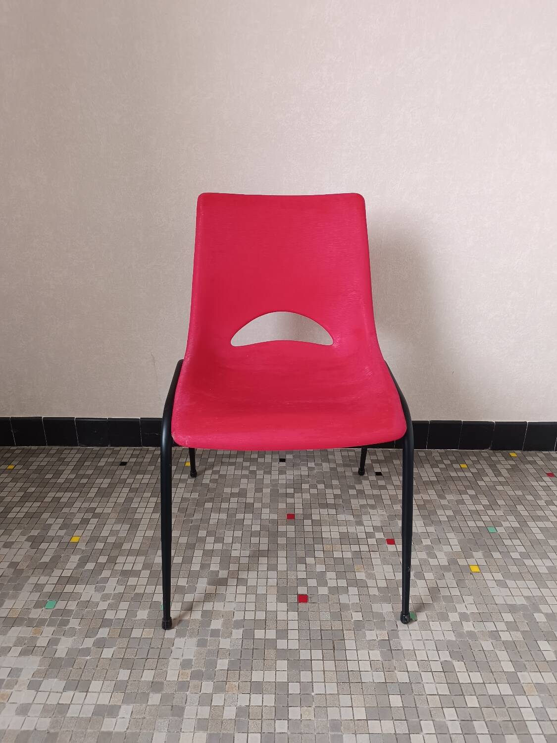 Vintage red plastic shell chair