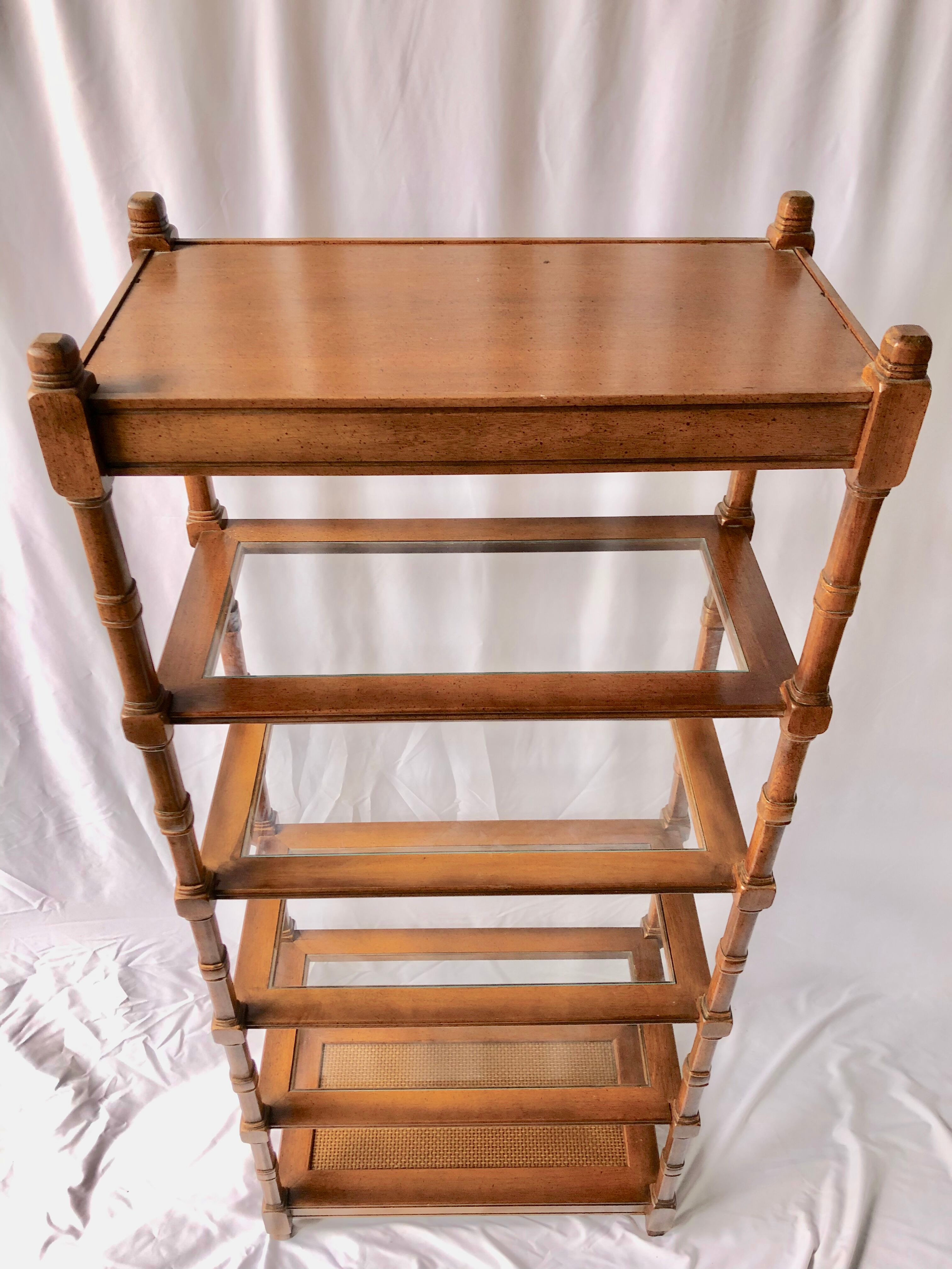 Classic wooden shelves, glass tops and cannage