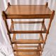 Classic wooden shelves, glass tops and cannage