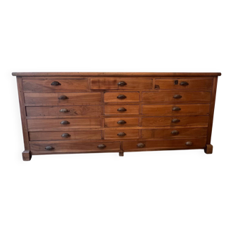 Industrial end piece of furniture with drawers.