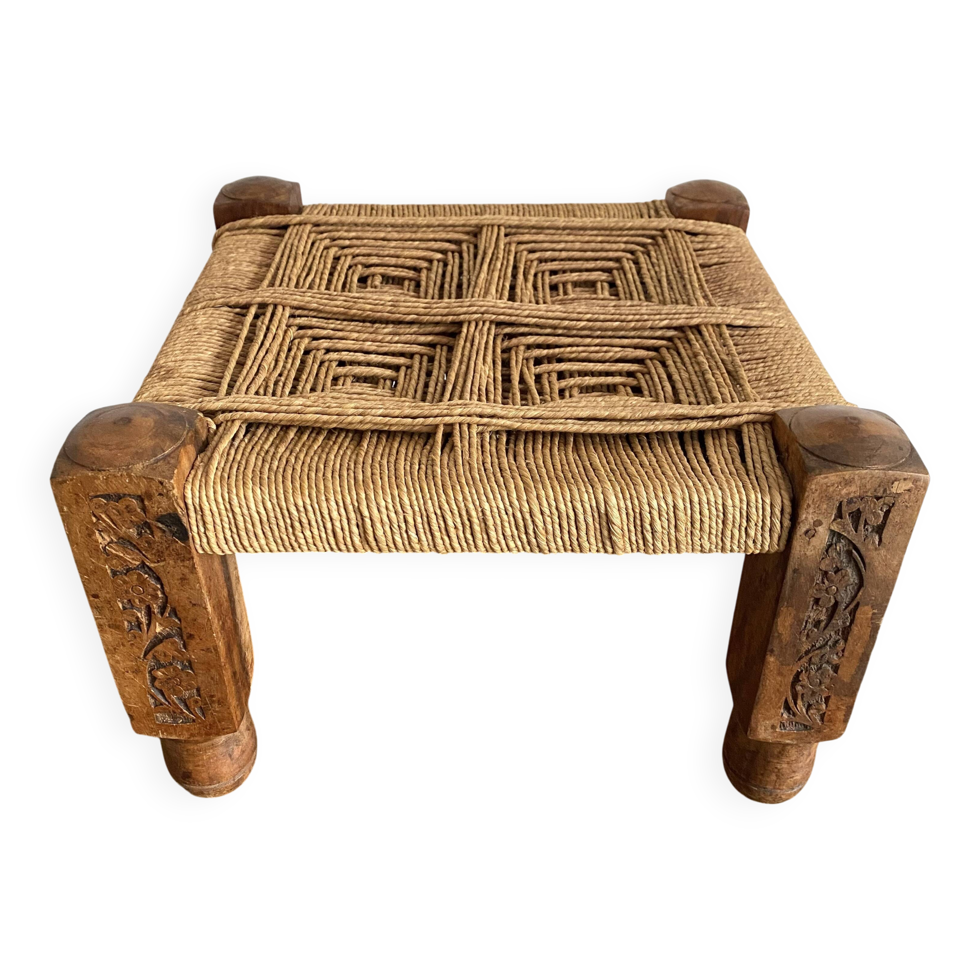 Low stool with carved wood and braided cord.