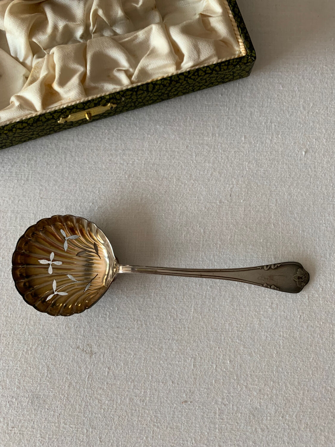 Old sauce pot and silver metal spoon