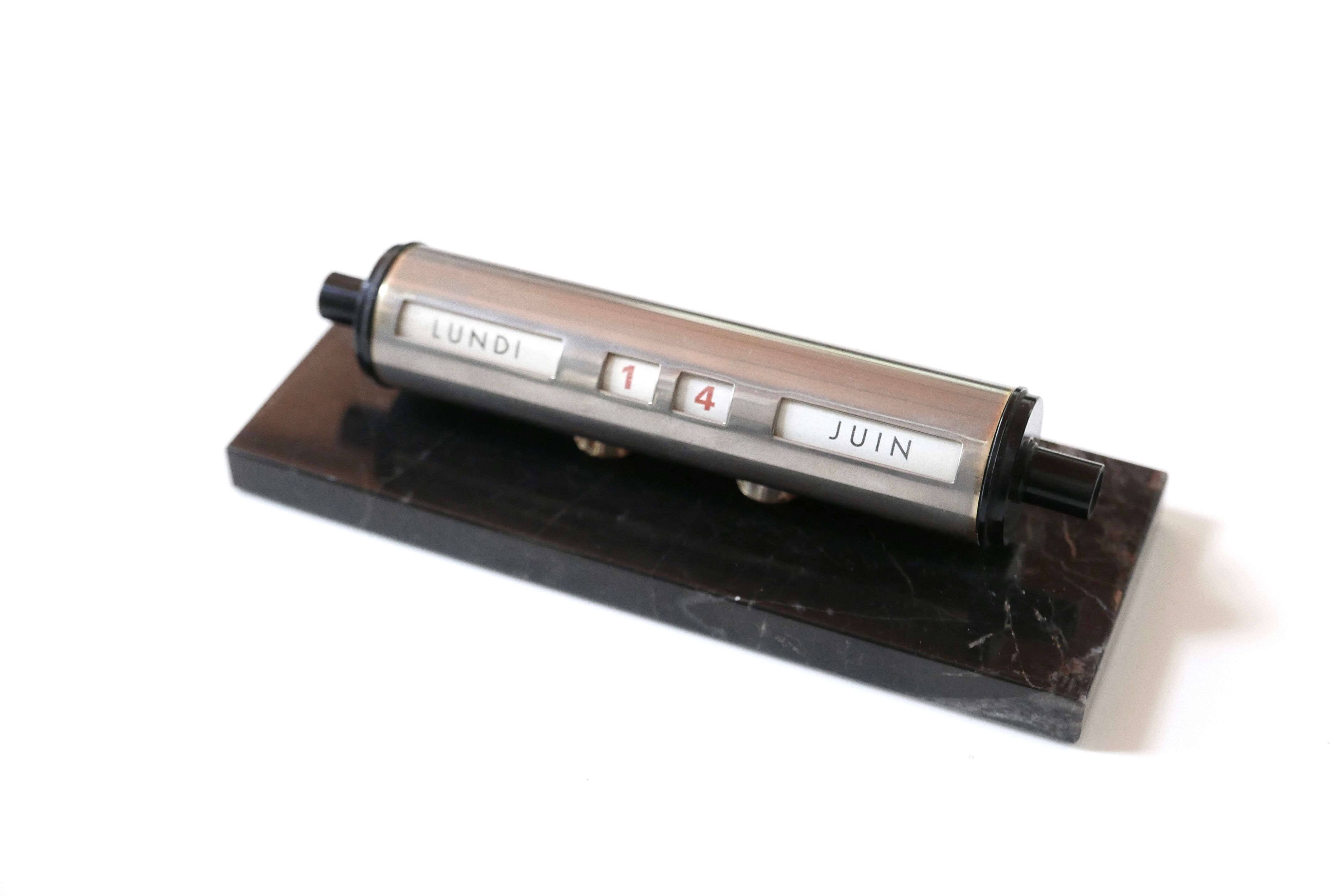 Tubular perpetual calendar, black marble base, 50s