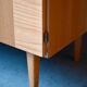 Vintage 1960s shoe cabinet in light wood and chrome metal.