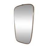 Vintage 1960s mirror in a freeform shape with a gold and red trim.