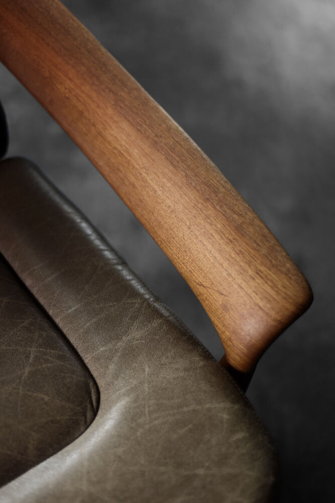 High teak and brown leather armchair with reclining backrest, mid-century Danish style, 1960s.