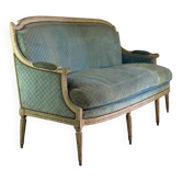 Louis XVI bench in carved wood, painted light green, 18th century.