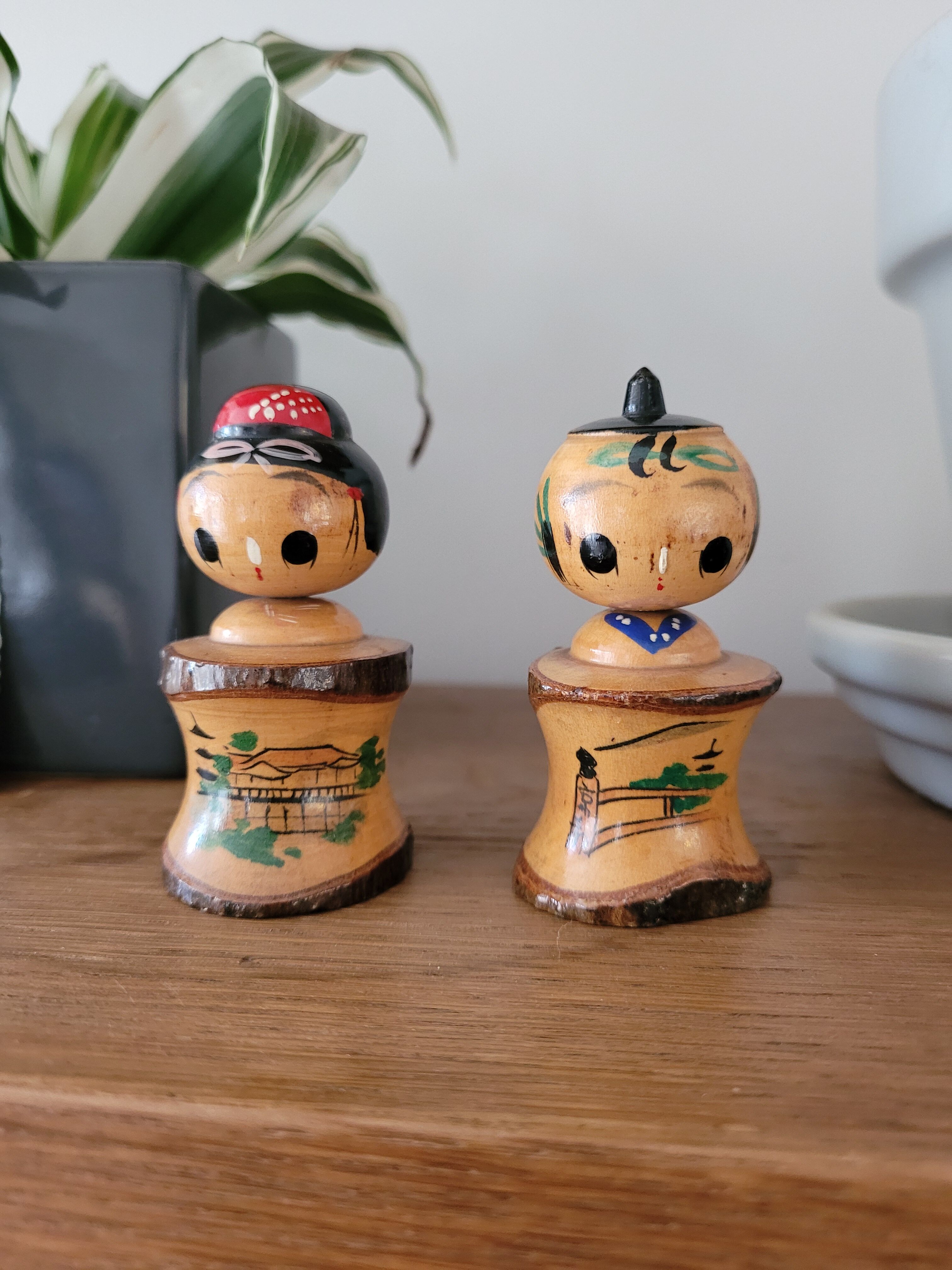 Two Kokeshi dolls