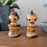 Two Kokeshi dolls