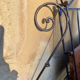 Wrought iron folding shelf
