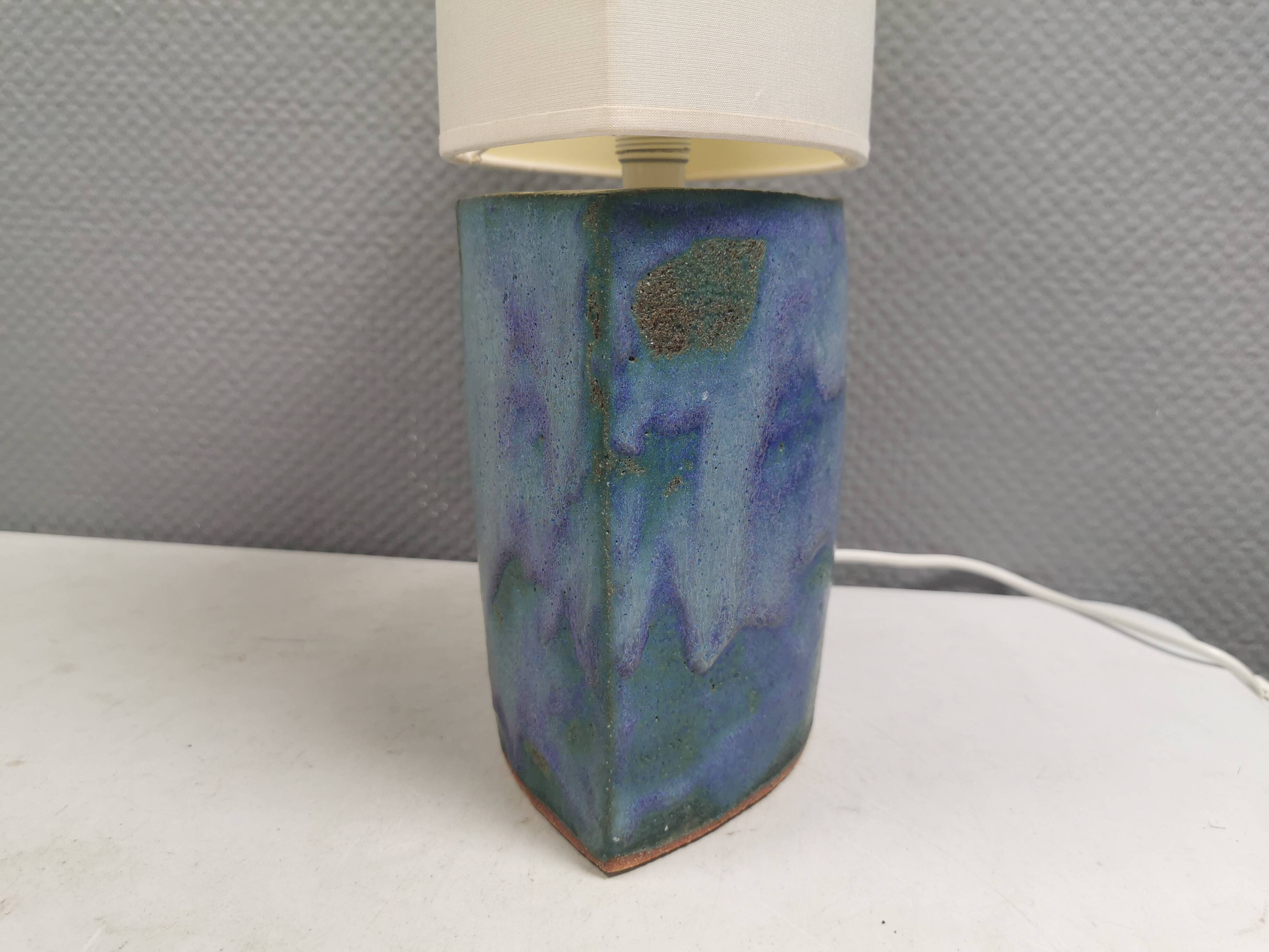 Sculptural table lamp in blue glaze with an abstract expression.