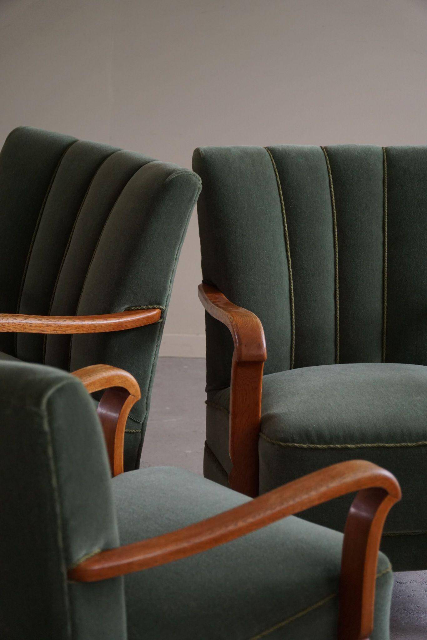 Danish Art Deco, set of 3 oak armchairs, reupholstered in green mohair, 1930s.