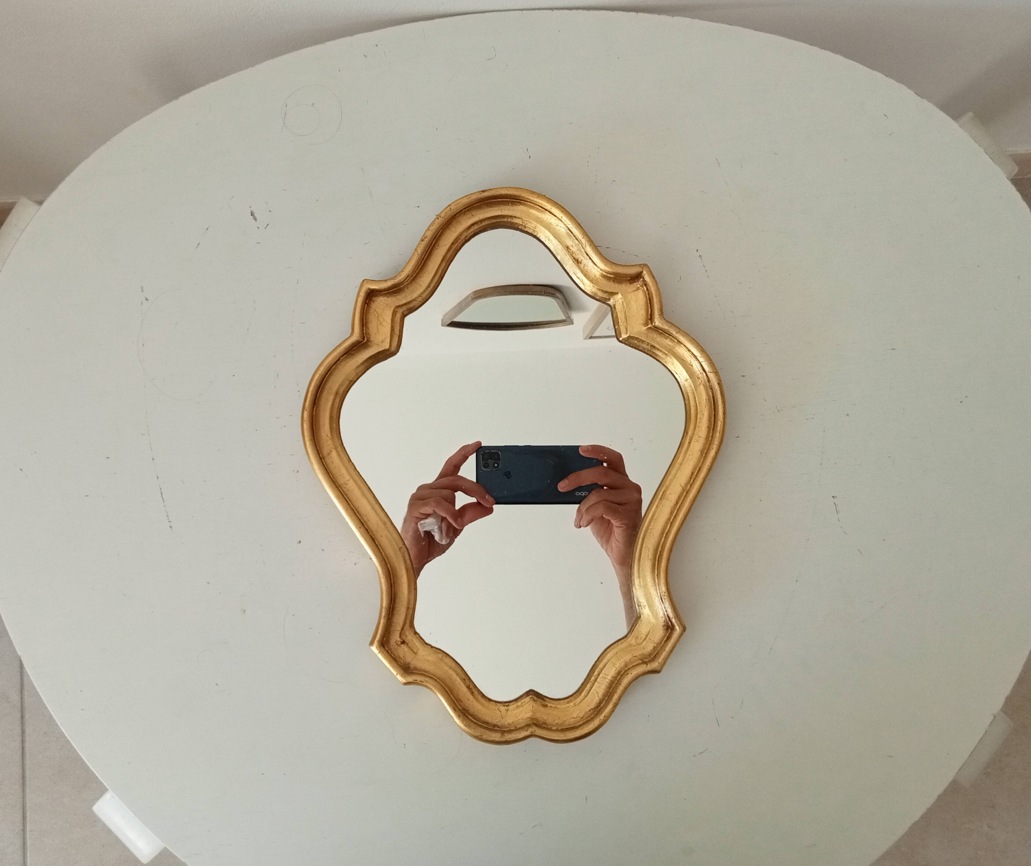 Baroque mirror in gilded wood from the 1960s.