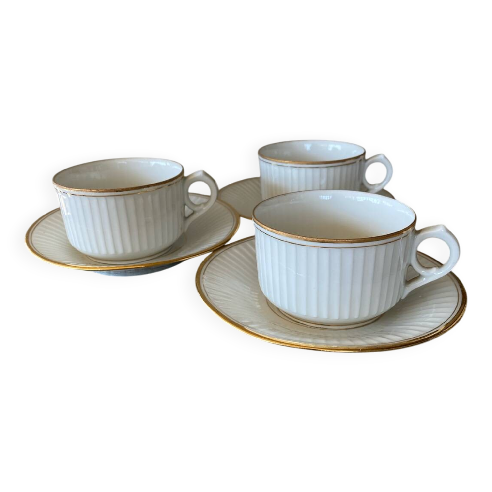 3 white and gold tea or chocolate cups