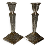 Pair of ornate silver candlesticks
