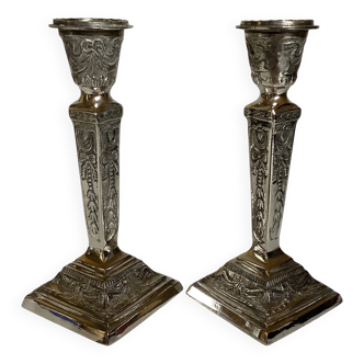 Pair of ornate silver candlesticks