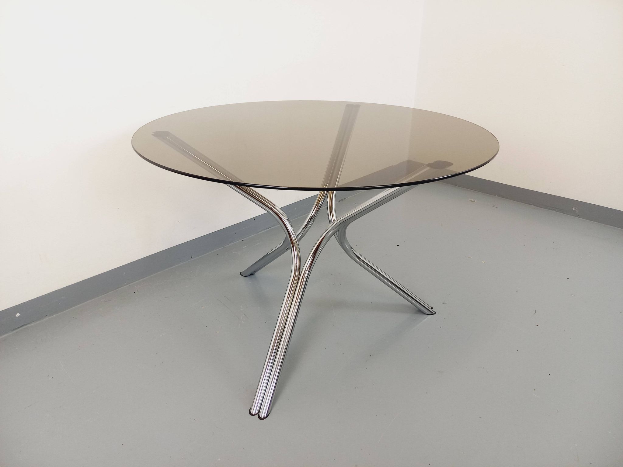 Vintage round dining table in smoked glass and chromed metal, Space Age style, from the 70s