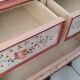 Painted chest of drawers with floral decoration