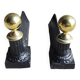 Old cast iron and brass andirons in neoclassical style