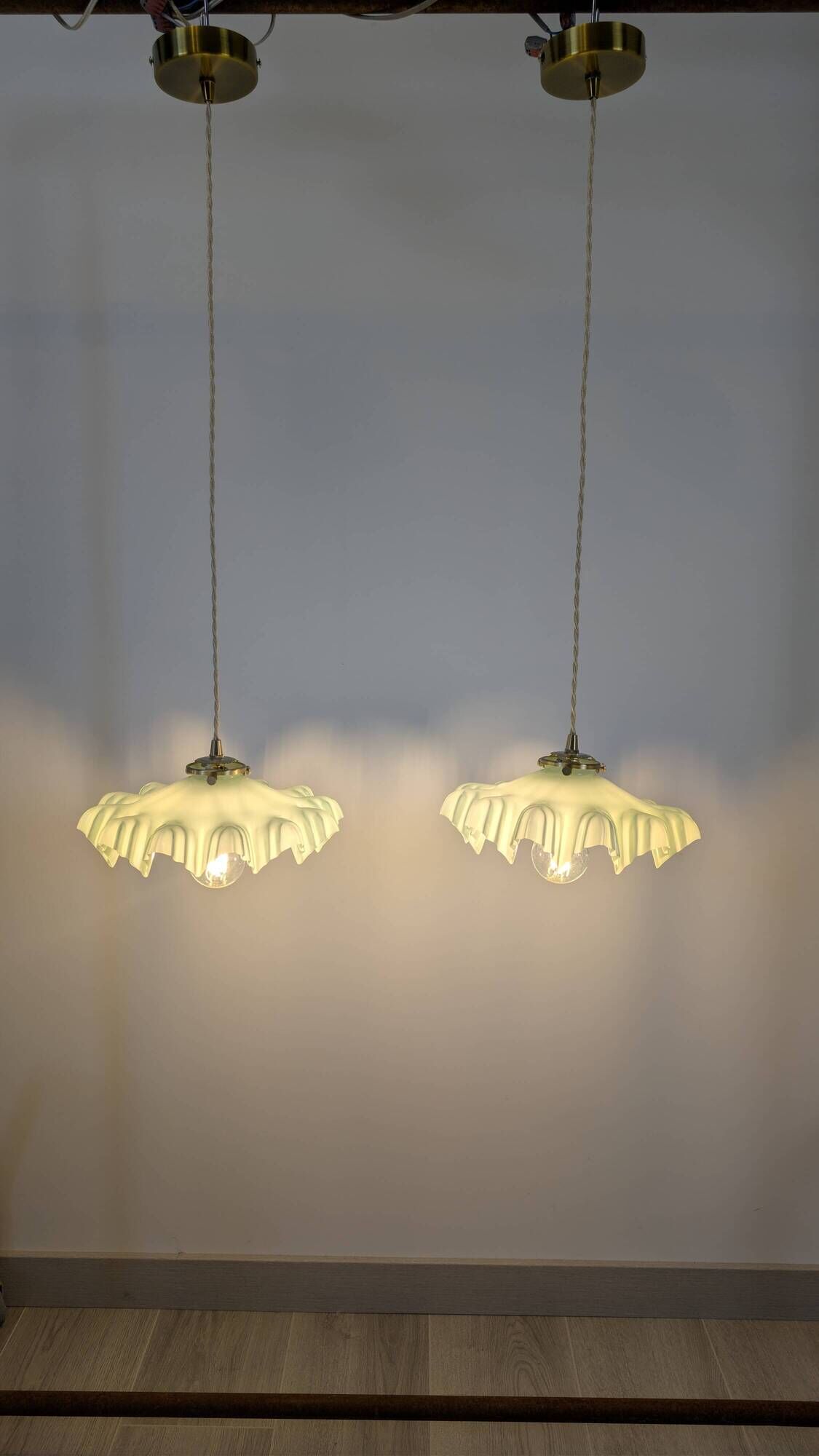 Pair of green opaline glass pendant lights – frosted poetry & Art Deco brilliance