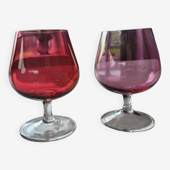 2 old and colored cognac glasses