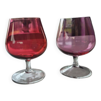 2 old and colored cognac glasses