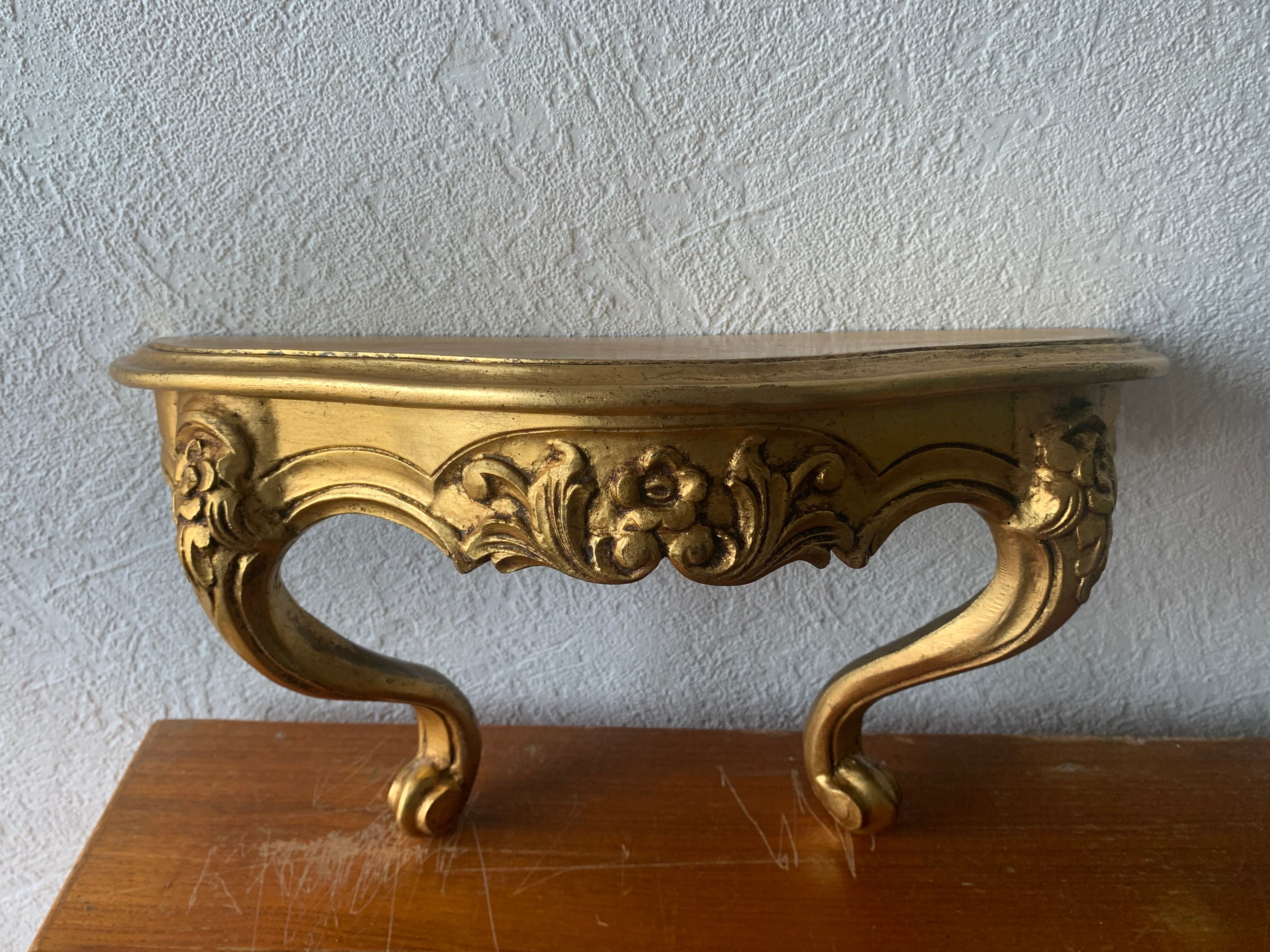 Gold wall shelf sellette