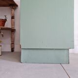 Old chest of drawers with two green drawers