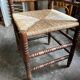 Corner chair in turned wood and straw