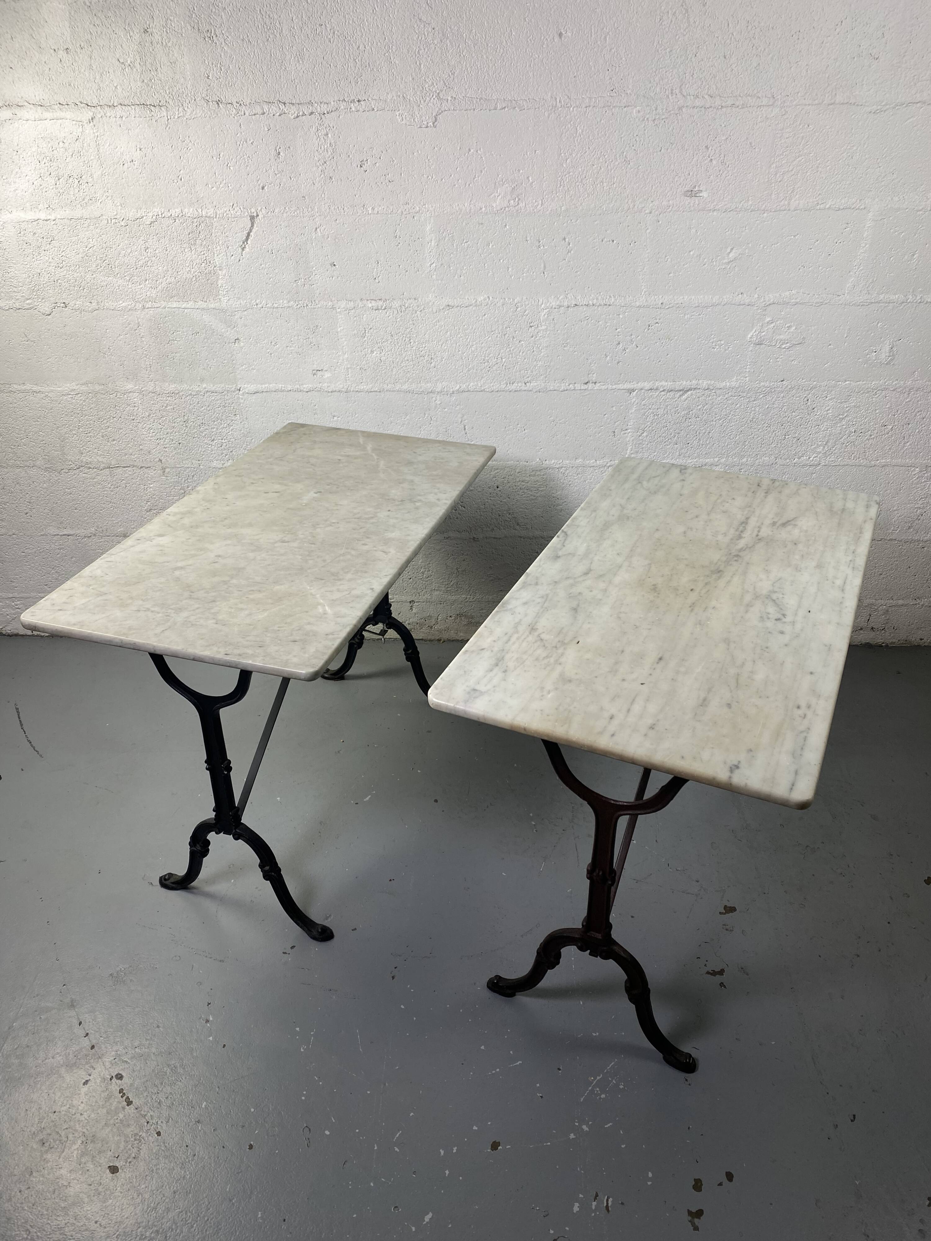 Set of two bistro tables in marble and wrought iron