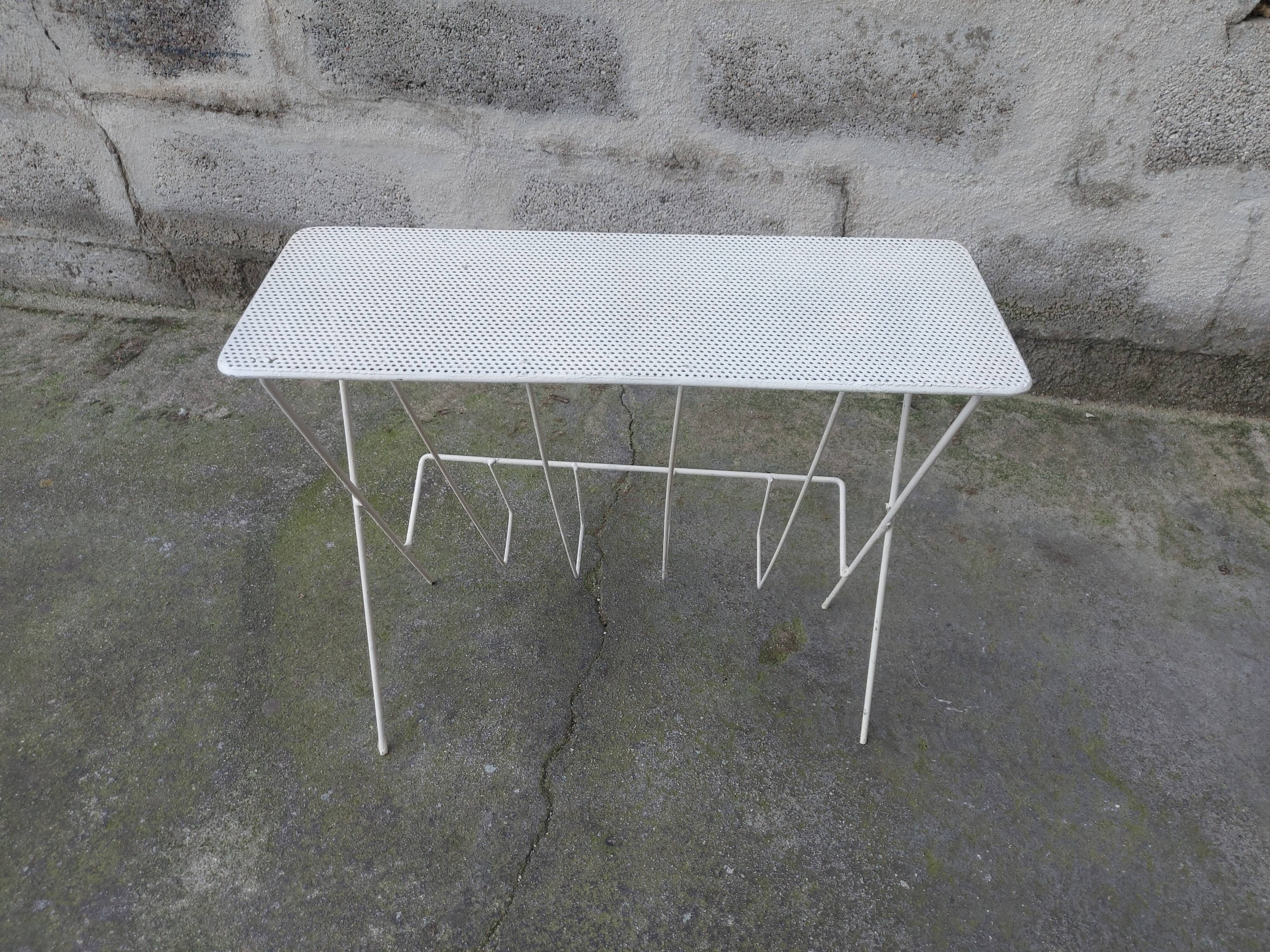 Vintage magazine holder in perforated metal