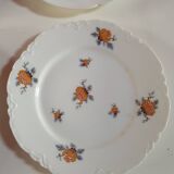 set of 4 dessert plates in white Limoges porcelain with flowers, the edge of one is different