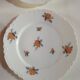 lot de  4 assiettes a dessert en porcelaine de limoges blanche a fleurs, le bord d'une est different