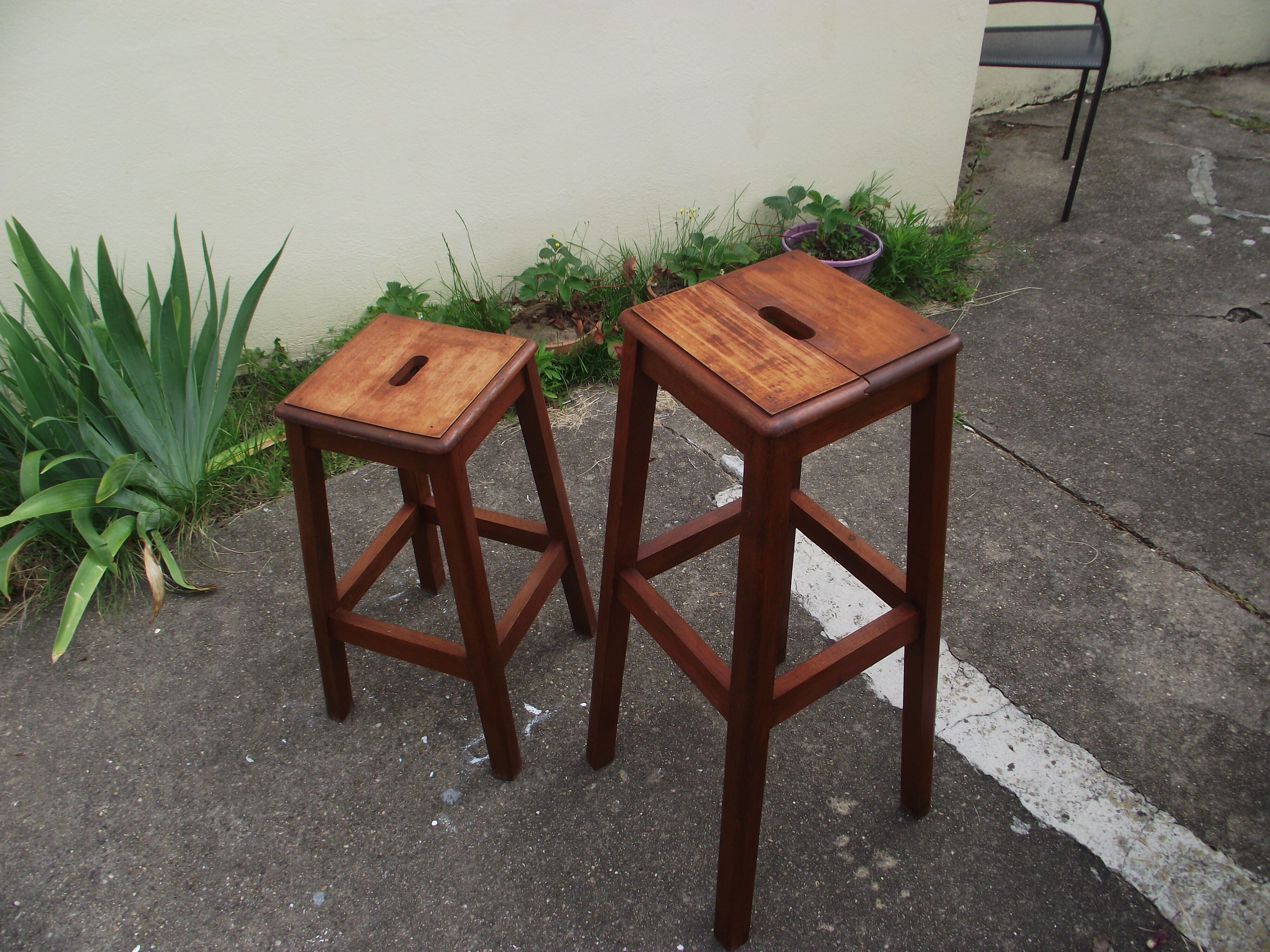 Two wooden artist stools in the early 20th century