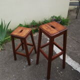 Two wooden artist stools in the early 20th century