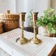 Duo de petits bougeoirs en laiton