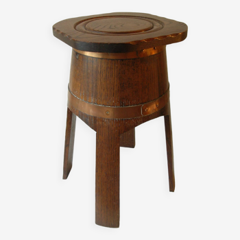 Old stool in the shape of a cider barrel, brass strapping, Normandy farmhouse kitchen