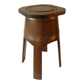 Old stool in the shape of a cider barrel, brass strapping, Normandy farmhouse kitchen